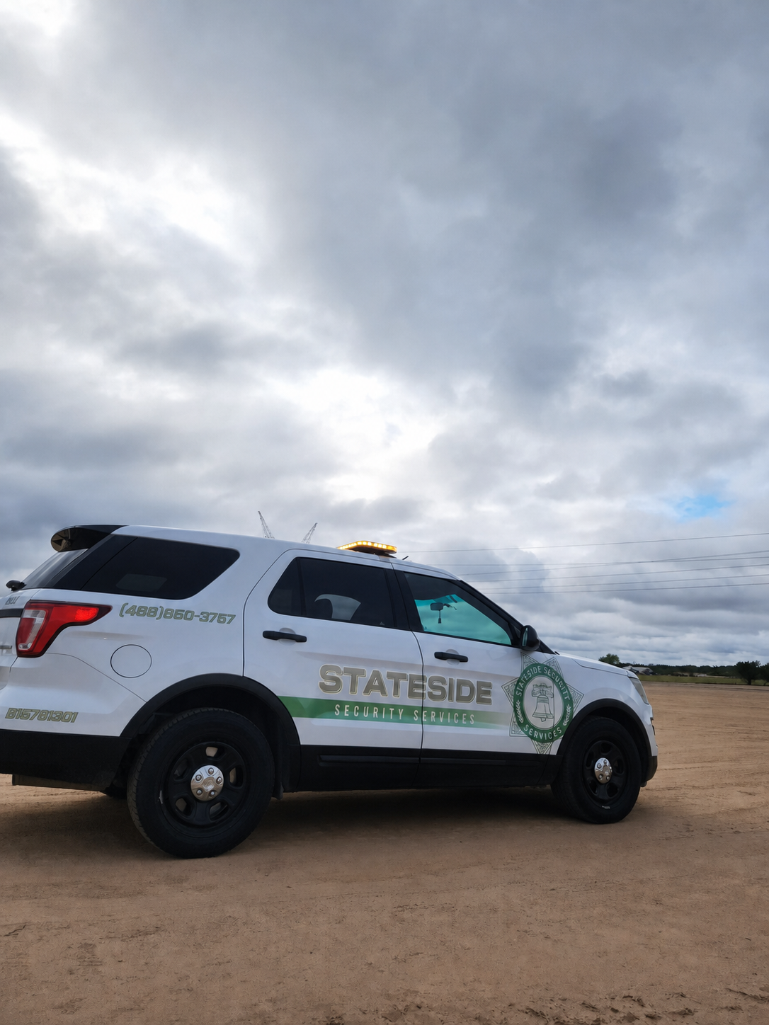 Stateside Security branded patrol vehicle daytime